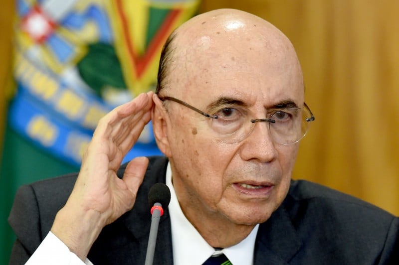  Brazilian Finance Minister Henrique Meirelles gestures at a press conference to explain the government's economic measures aimed at curbing public spending and reviving growth, in the Planalto Palace, the seat of government, in Brasilia on May 24, 2016. / AFP PHOTO / EVARISTO SA  
