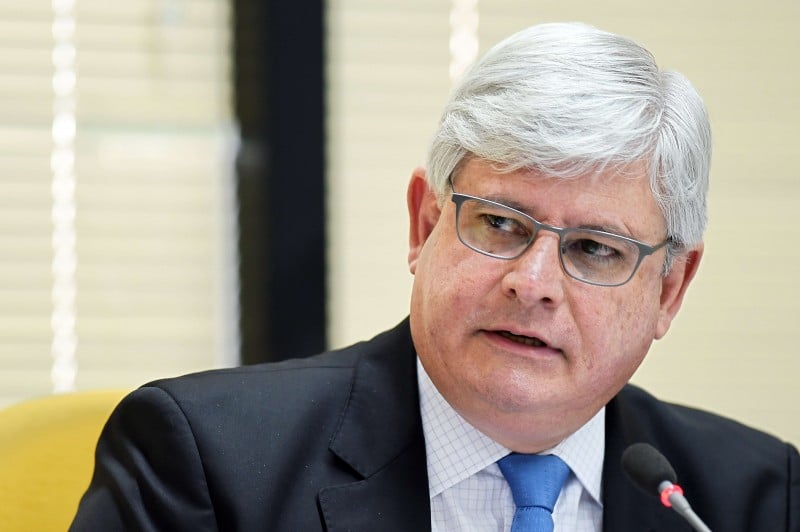  BRAZILIAN ATTORNEY GENERAL RODRIGO JANOT ATTENDS AN ADMINISTRATIVE SESSION AT THE ATTORNEY GENERAL OFFICE, IN BRASILIA, ON MARCH 3, 2015. JANOT INVESTIGATES THE PARTICIPATION OF POLITICIANS IN THE PETROBRAS CORRUPTION SCANDAL. DOZENS OF POLITICIANS FROM THREE PARTIES, INCLUDING FROM THAT OF BRAZILIAN PRESIDENT DILMA ROUSSEFF, HAVE BEEN IMPLICATED IN A CORRUPT NETWORK WHICH LAUNDERED $4 BILLION OF BRAZIL'S STATE OIL GIANT MONEY. AFP PHOTO/EVARISTO SA  
