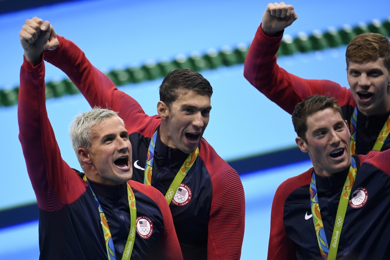 (FromL) USA's Ryan Lochte, USA's Michael Phelps, USA's Conor Dwyer and USA's Townley Haas pose with their gold medal after they won the Men's 4x200m Freestyle Relay Final during the swimming event at the Rio 2016 Olympic Games at the Olympic Aquatics Stadium in Rio de Janeiro on August 9, 2016. 
