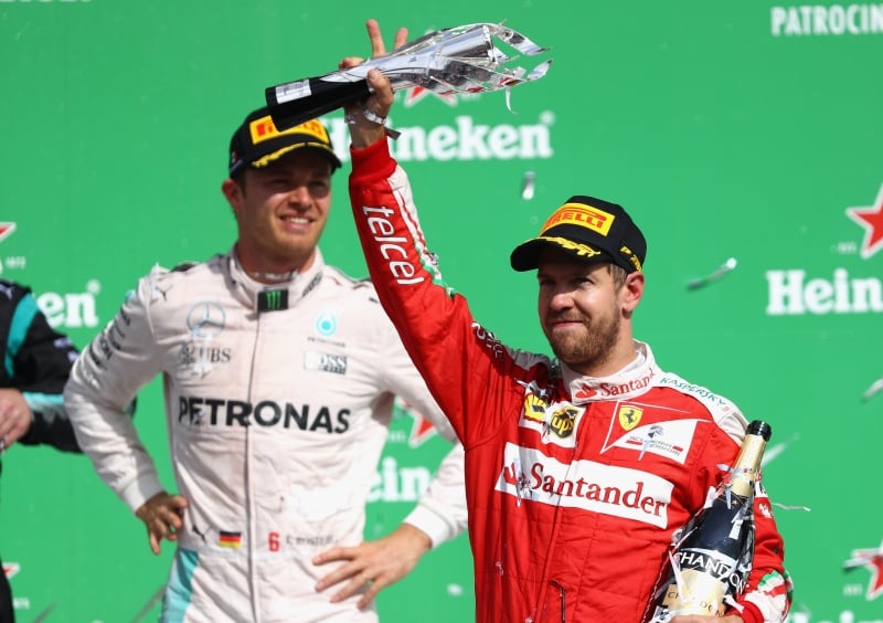 MEXICO CITY, MEXICO - OCTOBER 30: Sebastian Vettel of Germany and Ferrari celebrates finishing in third place on the podium during the Formula One Grand Prix of Mexico at Autodromo Hermanos Rodriguez on October 30, 2016 in Mexico City, Mexico.   
      Caption