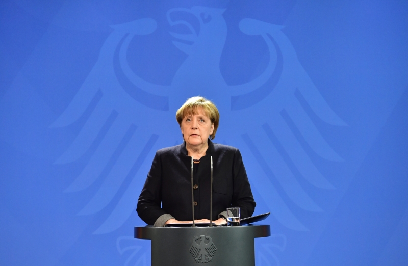 German Chancellor Angela Merkel speaks during a press conference on December 20, 2016 in Berlin following a terrorist attack the killing of 12 people when a speeding lorry cut a bloody swathe through a Berlin Christmas market.  / AFP PHOTO / John MACDOUGALL