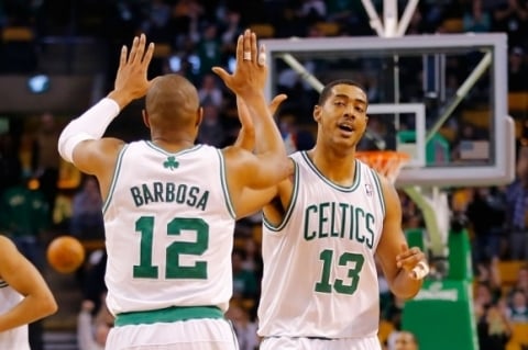 (FILES) This file photo taken on February 7, 2013 shows  Fab Melo #13 of the Boston Celtics being congratulated by teammate Leandro Barbosa #12 after making a basket in the fourth quarter against the Los Angeles Lakers during the game on February 7, 2013 at TD Garden in Boston, Massachusetts.
Former Syracuse University and Boston Celtics center Fab Melo has died in his native Brazil, military police said Sunday. He was 26. / AFP PHOTO / GETTY / Jared Wickerham