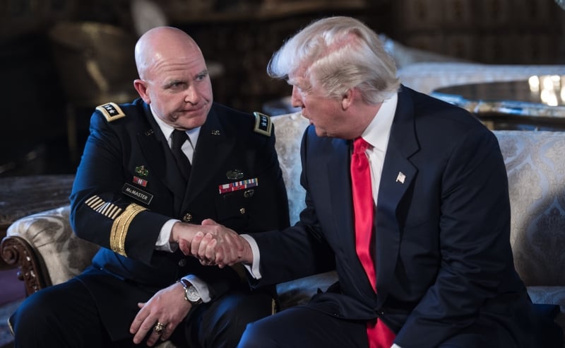 US President Donald Trump shakes hands with US Army Lieutenant General H.R. McMaster (L) as his national security adviser at his Mar-a-Lago resort in Palm Beach, Florida, on February 20, 2017. 