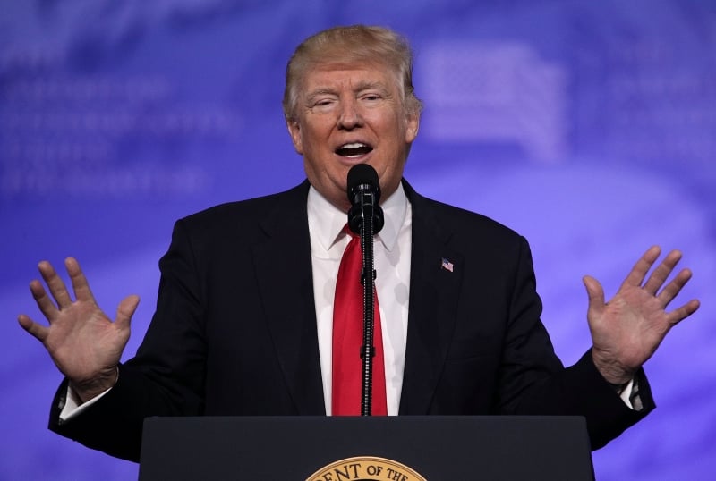 NATIONAL HARBOR, MD - FEBRUARY 24: U.S. President Donald Trump addresses the Conservative Political Action Conference at the Gaylord National Resort and Convention Center February 24, 2017 in National Harbor, Maryland. Hosted by the American Conservative Union, CPAC is an annual gathering of right wing politicians, commentators and their supporters.   Alex Wong/Getty Images/AFP
== FOR NEWSPAPERS, INTERNET, TELCOS & TELEVISION USE ONLY ==
      Caption