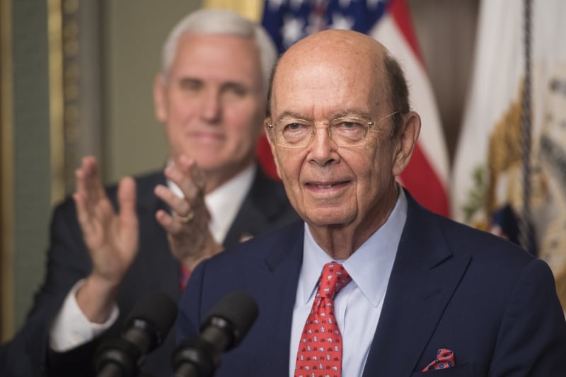 US Secretary of Commerce Willbur Ross (R) speaks after being sworn in by US Vice President Mike Pence (L) in the Old Executive Office Building in Washington, DC, February 28, 2017. / AFP PHOTO / JIM WATSON
      Caption