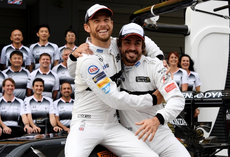 (FILES) This file photo taken on October 7, 2016 shows McLaren Honda's British driver Jenson Button (L) joking with his teammate Fernando Alonso of Spain (R) during the team's photo session at the Formula One Japanese Grand Prix in Suzuka.
Britain's Jenson Button will come out of retirement for 
