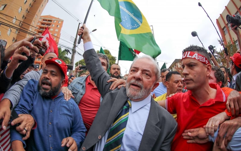 A hand out picture released by Instituto Lula showing Brazil's former president (2003-2010) Luiz InÁcio Lula da Silva amid supporters while arrives at a Federal Justice Court in Curitiba, Brazil for a hearing with senior 