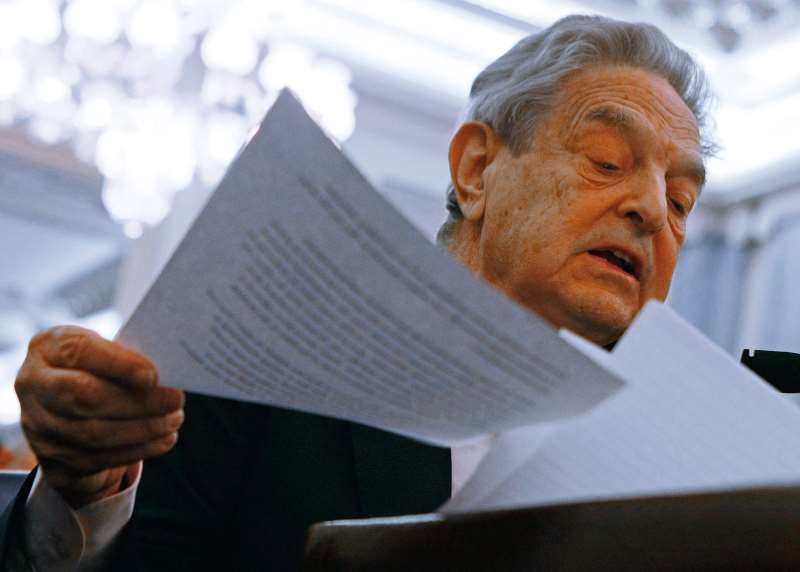 GEORGE SOROS, CHAIRMAN OF THE SOROS FUND MANAGEMENT, READS HIS STATEMENT WHILE PARTICIPATING IN A SENATE COMMERCE, SCIENCE AND TRANSPORTATION COMMITTEE HEARING ON CAPITOL HILL, JUNE 3, 2008 IN WASHINGTON DC.  THE COMMITTEE IS HEARING TESTIMONY ON ENERGY MARKET MANIPULATION AND FEDERAL ENFORCEMENT REGIMES.    MARK WILSON/GETTY IMAGES/AFP  = FOR NEWSPAPERS, INTERNET, TELCOS AND TELEVISION USE ONLY =