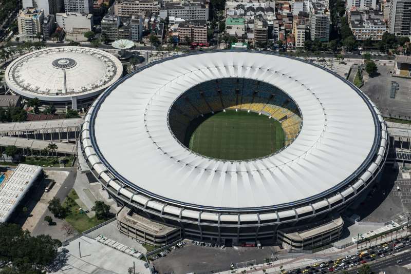 (FILE) AERIAL VIEW OF THE MARIO FILHO (MARACANA) STADIUM IN RIO DE JANEIRO, BRAZIL, ON DECEMBER 3, 2013. THE MARACANA STADIUM WILL HOST THE BRAZIL 2014 FIFA WORLD CUP AND THE 2016 SUMMER OLYMPICS. THE MARACANÃ STADIUM, A FOOTBALLING MECCA WHICH EVERY FAN DREAMS OF VISITING, HAS MORPHED INTO AN ULTRA-MODERN, SUSTAINABLE AND SAFE ARENA, ALBEIT ONE WITH ELITIST TRAITS, COMPARED TO THE POPULIST TEMPLE IT ONCE WAS.  AFP PHOTO / YASUYOSHI CHIBA