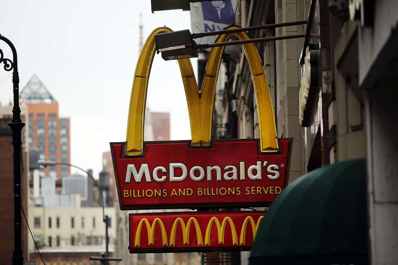 NEW YORK, NY - FEBRUARY 09: A MCDONALD'S SIGN HANGS IN LOWER MANHATTAN ON FEBRUARY 9, 2015 IN NEW YORK CITY. MCDONALD'S CORPORATION HAS SAID SALES IN JANUARY FELL A WORSE-THAN-EXPECTED 1.8%. WHILE THE FAST-FOOD RESTAURANT CHAIN SAID U.S. AND EUROPE SALES SHOWED SIGNS OF IMPROVEMENT, ASIA SALES SLOWED. MCDONALD'S IS FACING NEW COMPLETION FROM TRENDIER AND MORE HEALTH CONSCIOUS FAST FOOD CHAINS LIKE CHIPOTLE MEXICAN GRILL AND SHAKE SHACK.   SPENCER PLATT/GETTY IMAGES/AFP

== FOR NEWSPAPERS, INTERNET, TELCOS & TELEVISION USE ONLY ==